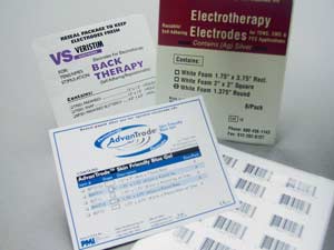Assorted packaging for electrotherapy electrodes and electrode pads, featuring product labels, instructions, and barcode stickers on a white surface—ideal for industrial manufacturing and contract converting applications.